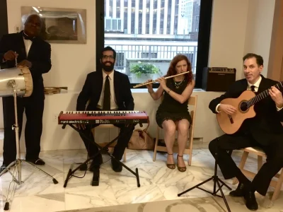 Tomas Rodriguez performing with a Brazilian quartet at a corporate event at Embraer's Manhattan headquarters.